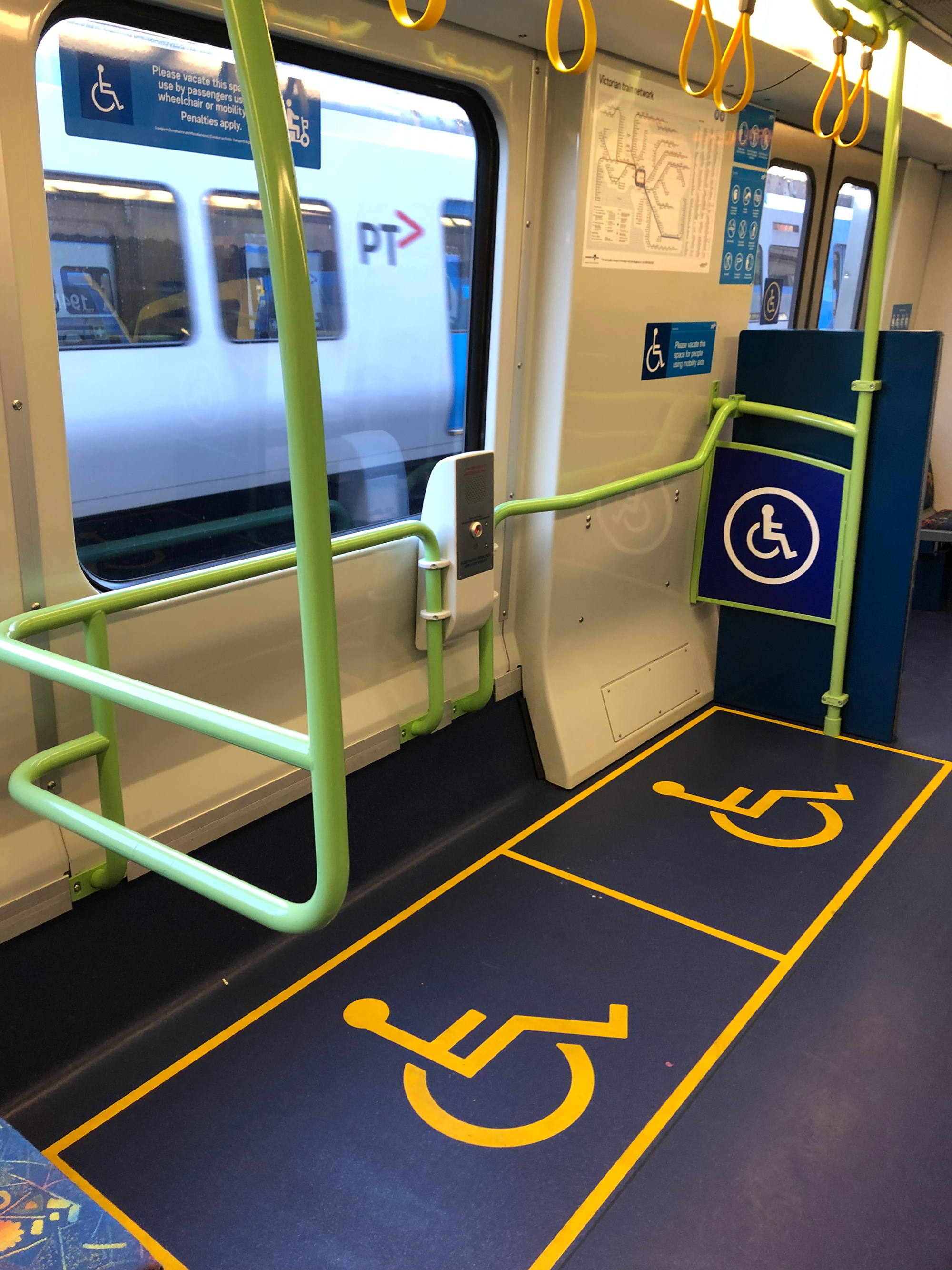 Photo of allocated spaces for wheelchairs in a train carriage 