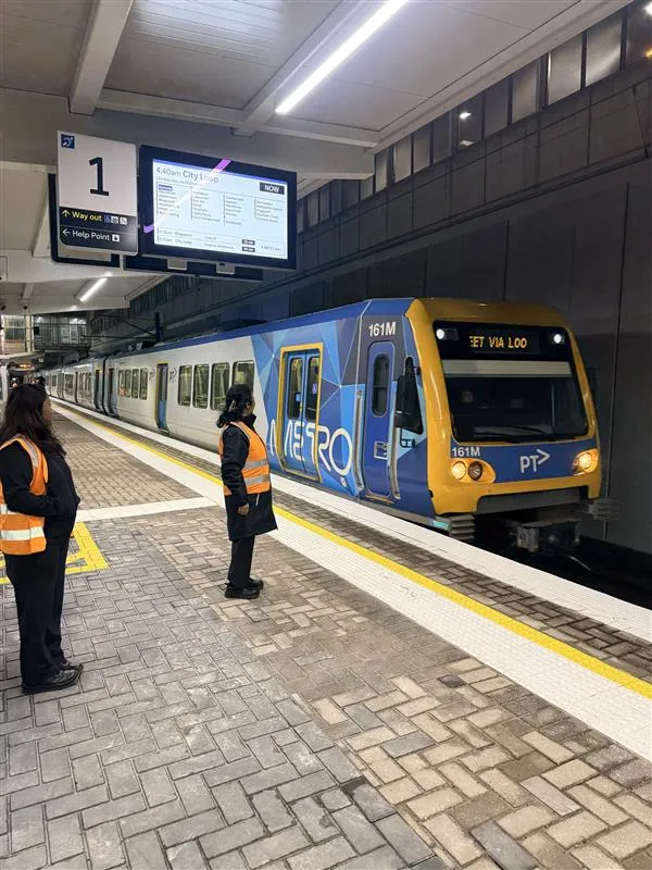 Pam welcoming the first train back into Boronia Station